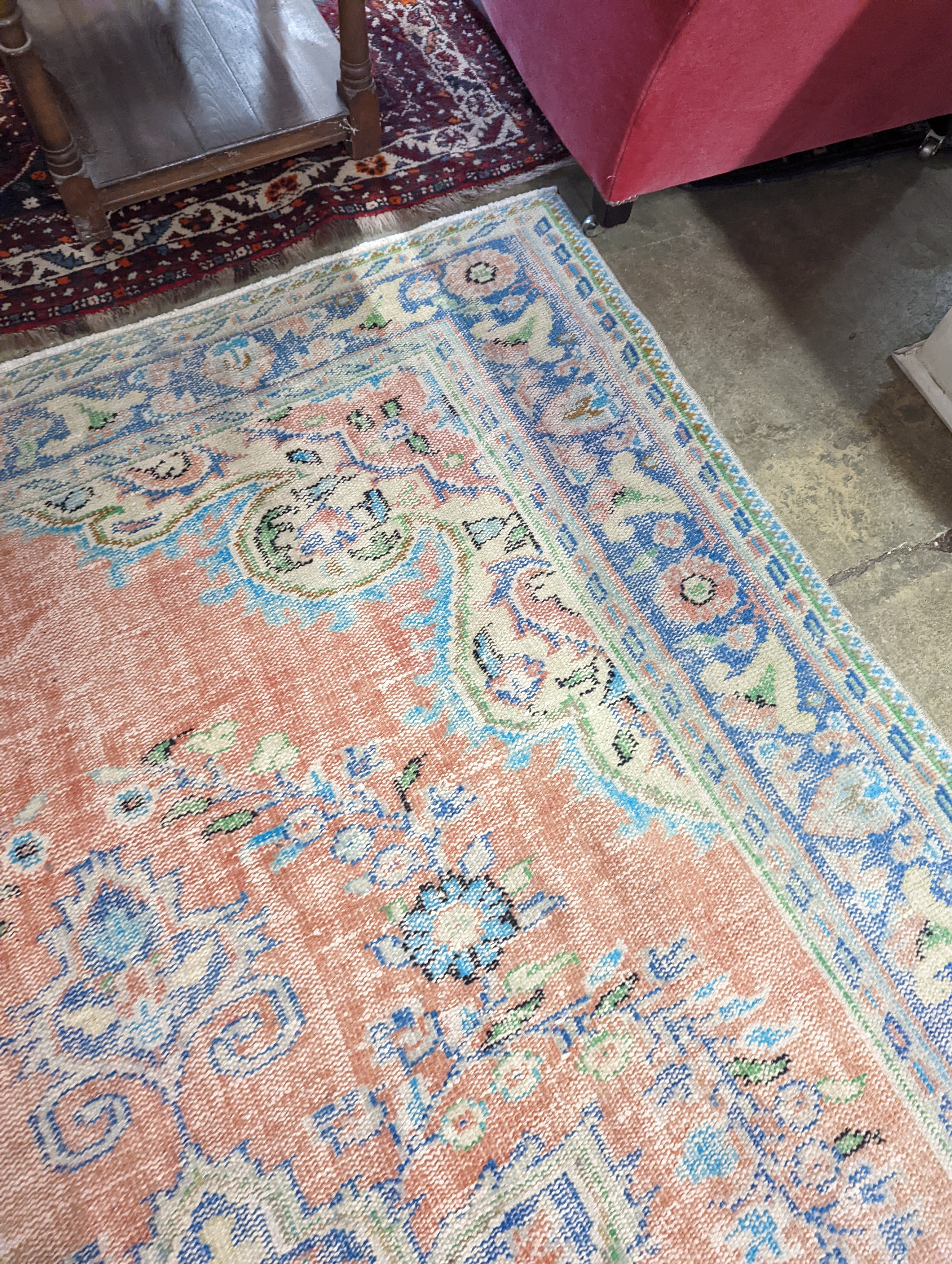 A North West Persian style faded wool carpet, 300 x 196cm